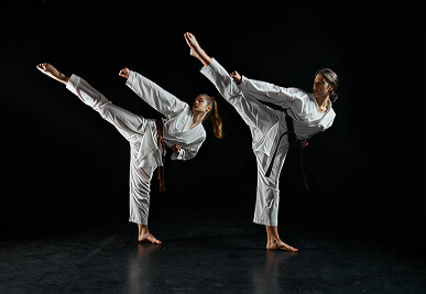 Martial artists performing kicks